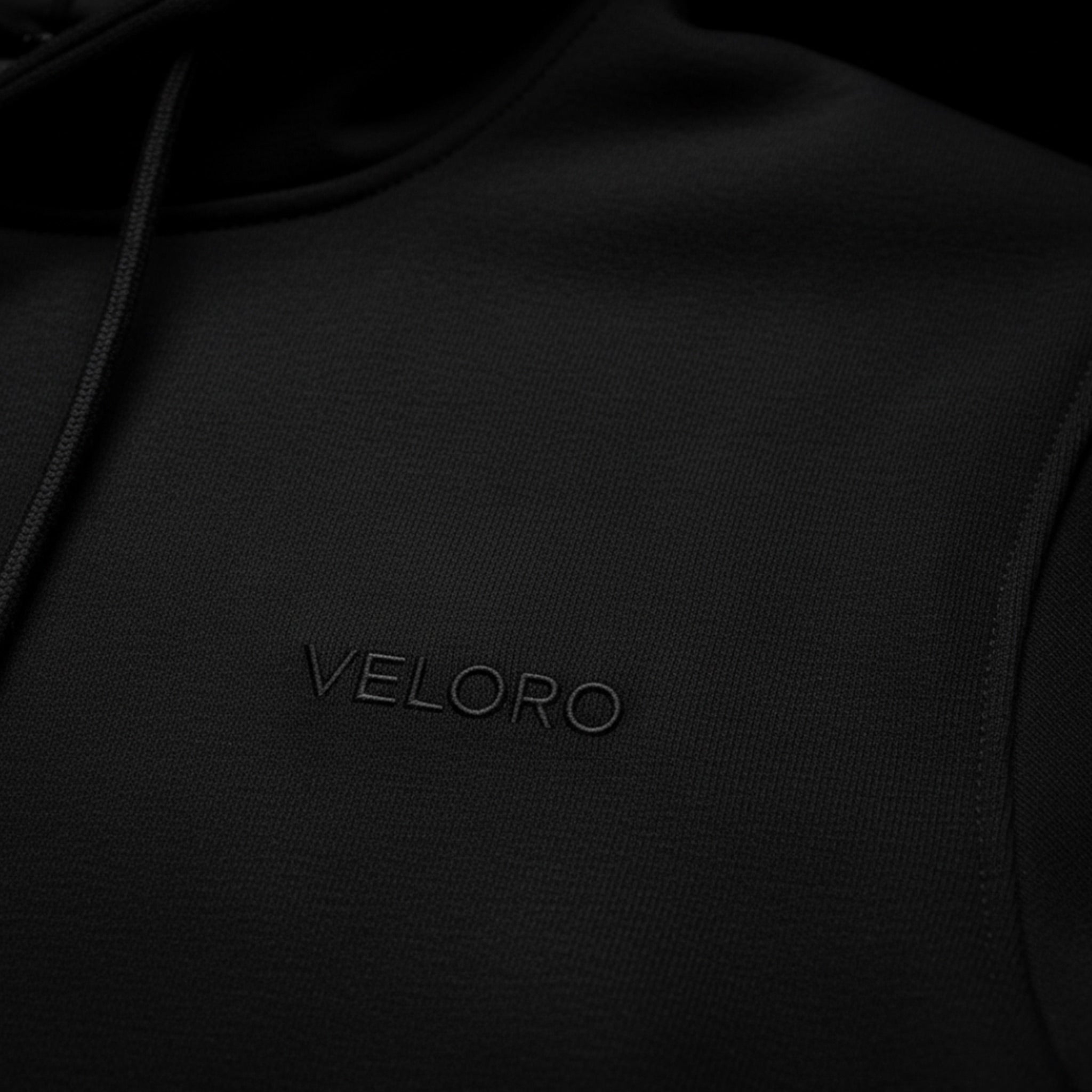 Black hoodie with 'VELORO' logo on a black background